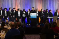 Image of students on stage ready to perform.